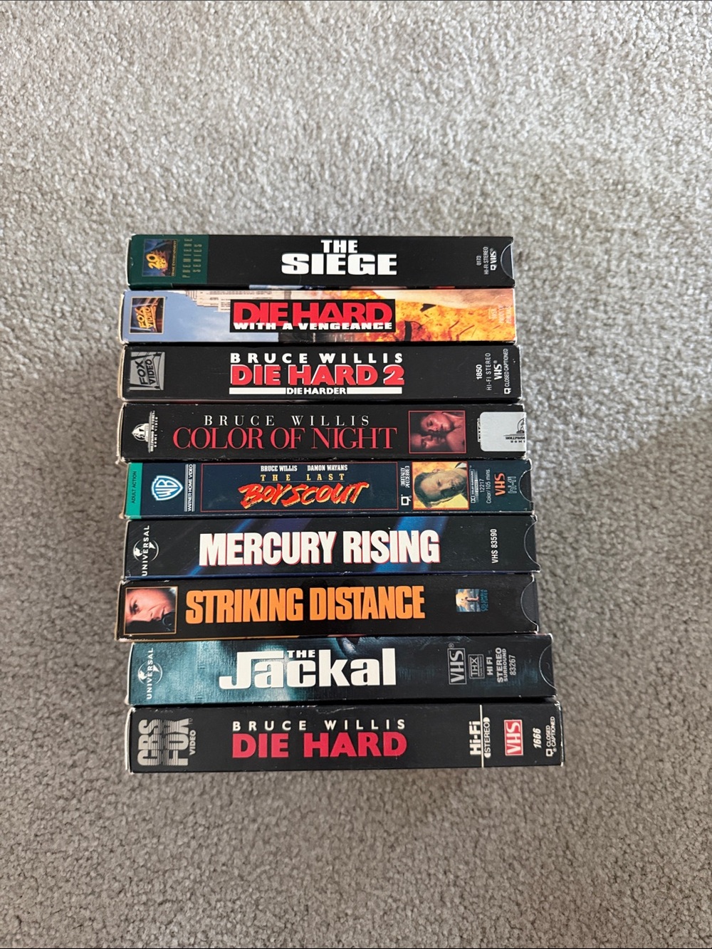 vintage action and thriller VHS tapes featuring actor Bruce Willis